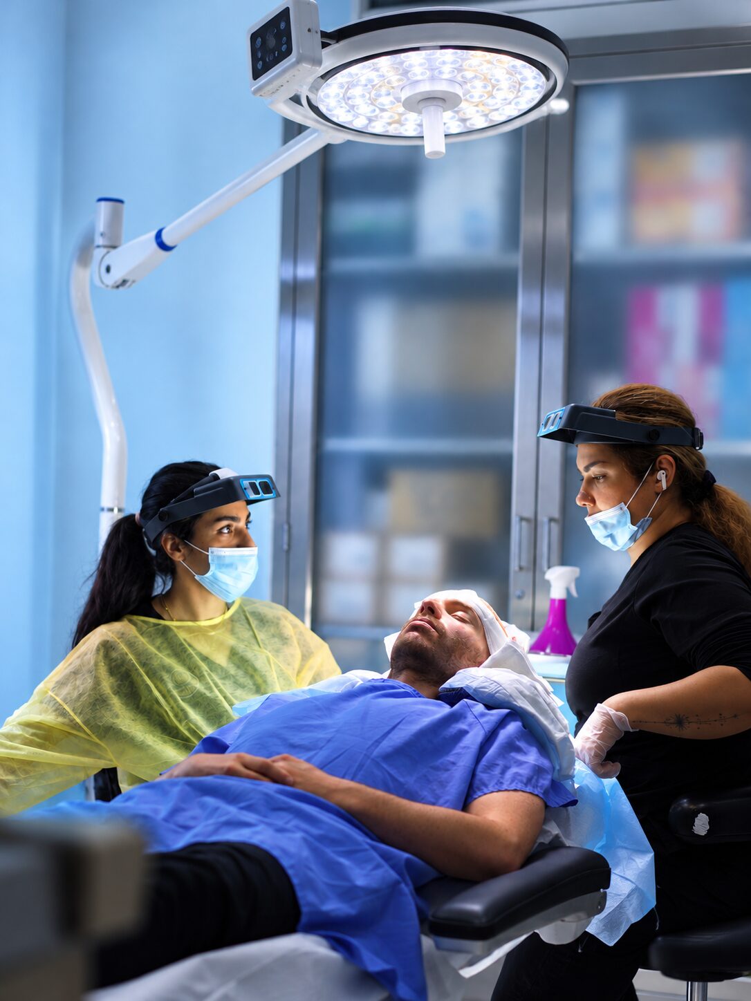 Technician working under magnifying loupes during a procedure at Nova Medical Wisconsin